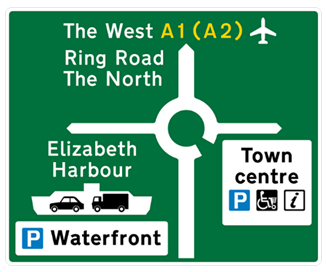 Green road sign with white, black and orange text showing destinations, directions and parking
