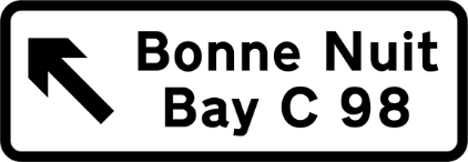 White road sign with black text showing destination and direction