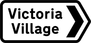 White road sign with black text showing destination and direction