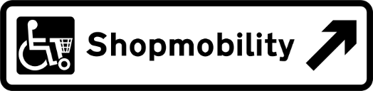 White road sign with black text and, shop mobility symbol and direction