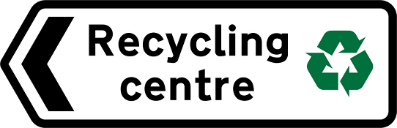 White road sign with black text and, green recycling symbol and direction